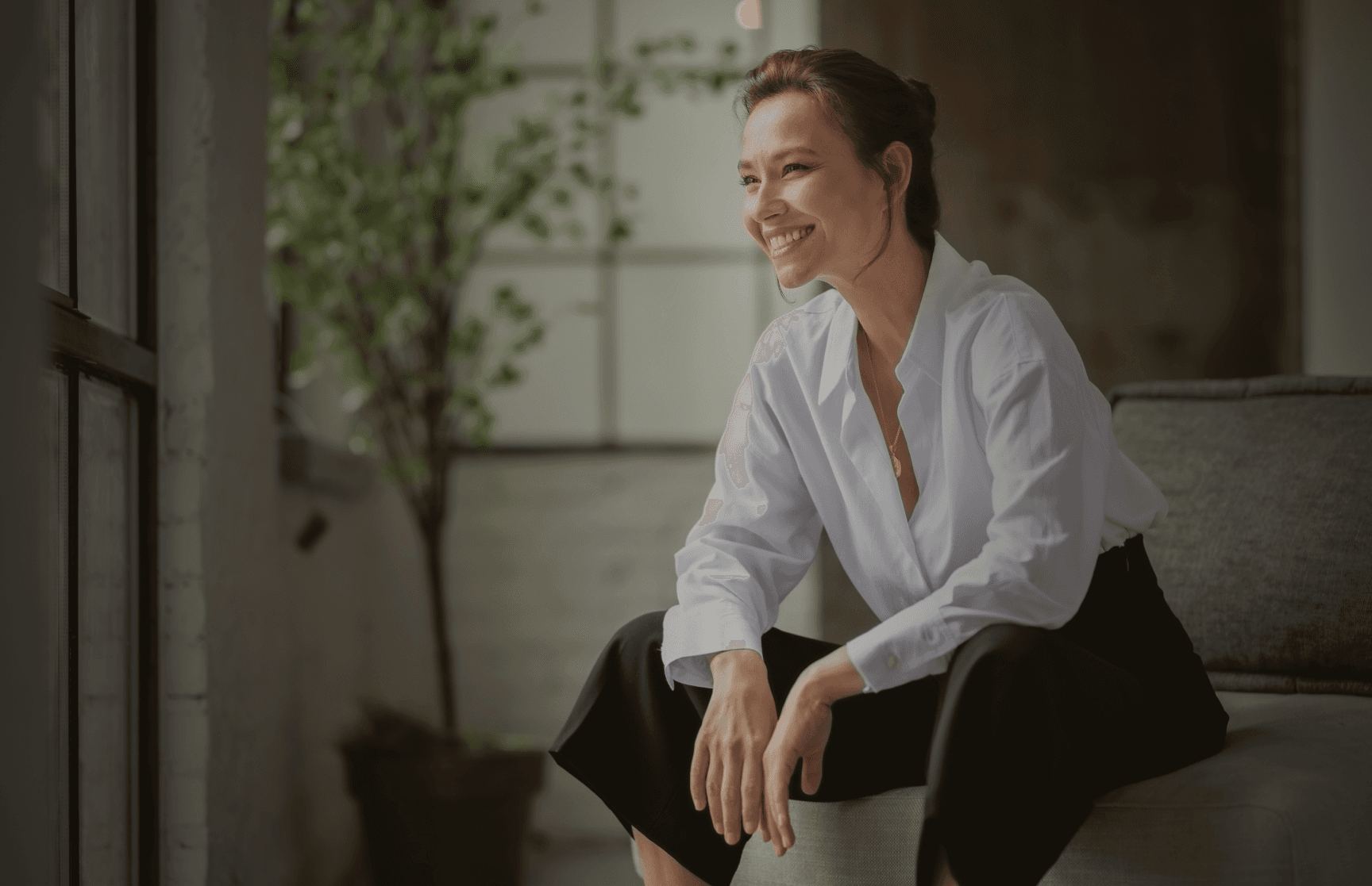 woman sitting smiling